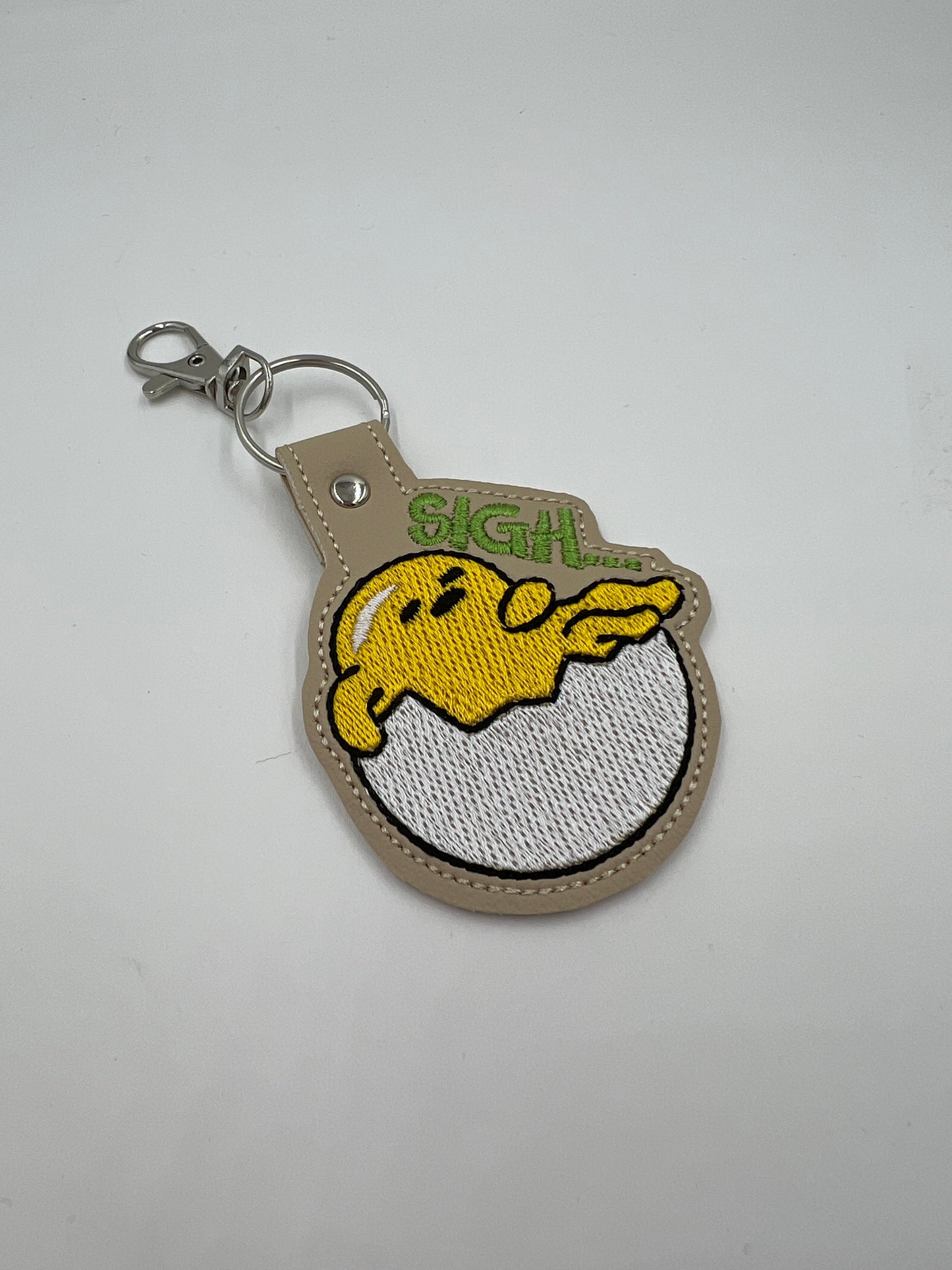 Sigh Lazy Egg Keychain